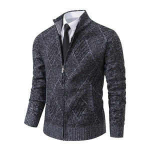 Close-up of the knitted argyle texture and metal zipper on this men's cardigan