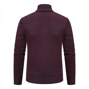 Detail view of the back of a burgundy men's knit cardigan with ribbed cuffs and hem