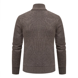 Detail view of brown men's knit cardigan back with ribbed cuffs and textured finish