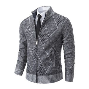 Macro detail of geometric diamond knit texture and sturdy zip on the cardigan