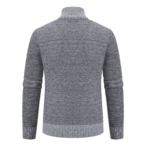 Rear view of men's dark grey knit cardigan showing thick texture and ribbed hem