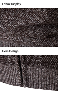 Detail of dark brown waffle knit fabric texture and ribbed hem with metal zipper