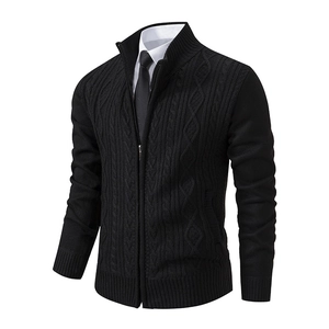 Detailed view of the classic cable knit pattern on a black standing collar cardigan