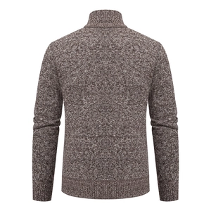 Macro detail of brown melange knit texture and ribbed hem on the men cardigan back