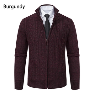 Detail of burgundy cable knit cardigan featuring a high collar and full zipper closure
