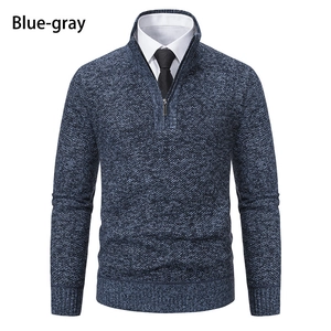 Detail showing blue-gray melange knit texture and quarter-zip stand collar on men's sweater