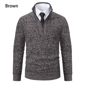 Detail of men's brown knit sweater showing stand collar zipper and textured fabric