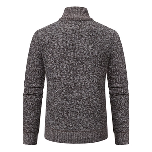 Rear view of marled brown and white knit sweater with mock neck and ribbed hem details