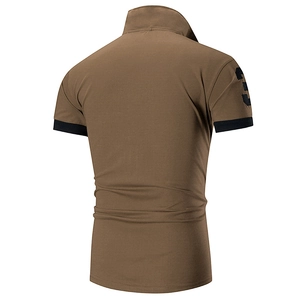 Detail of slim-fit brown polo shirt showing contrast black cuffs and number 3 embroidery