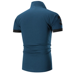 Detail of navy blue polo shirt featuring embroidered number three on the sleeve cuff