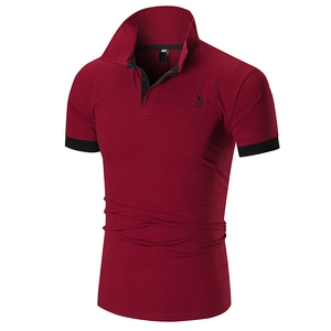 Close-up of embroidered giraffe logo and black contrast trim on wine red polo shirt