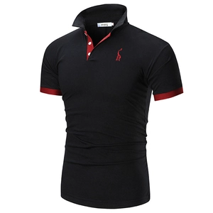 Detail of slim fit black polo shirt with red contrast collar and embroidered logo