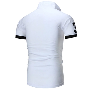 Detail view of white Polo shirt with black contrast cuffs and number 3 embroidery print