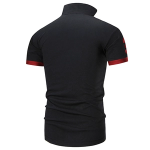 Back view of black polo shirt featuring red contrast cuffs and sleeve embroidery detail