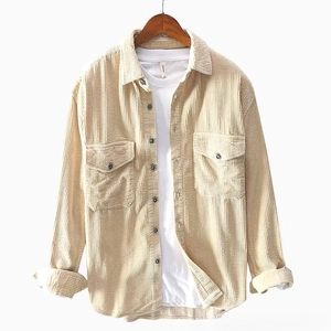 Beige men's corduroy long sleeve shirt with double pockets over a white t-shirt