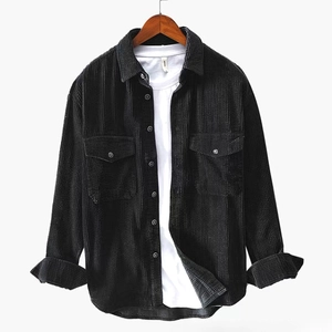 Men's black corduroy long sleeve shirt with chest pockets on a wooden hanger