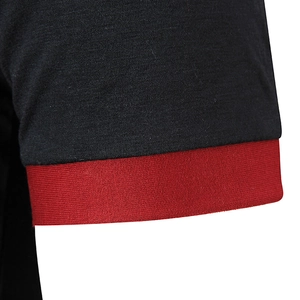 Detail of men's polo shirt cuff featuring black knit fabric and red ribbed edges