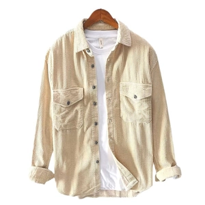 Men's beige corduroy long sleeve shirt with dual chest pockets on wooden hanger
