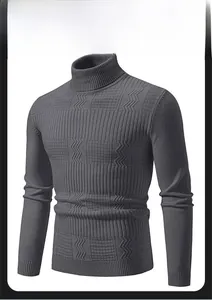 Detail of dark grey turtleneck sweater featuring geometric knit texture and ribbed cuffs