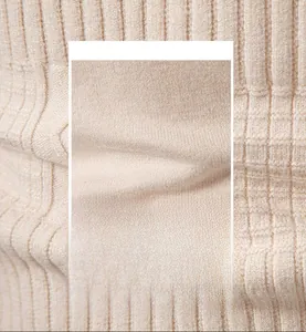 Detailed macro view of beige vertical ribbed knit fabric with soft breathable texture