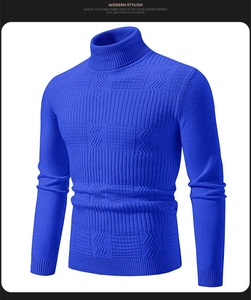 Macro detail of royal blue turtleneck sweater featuring complex geometric knit textures