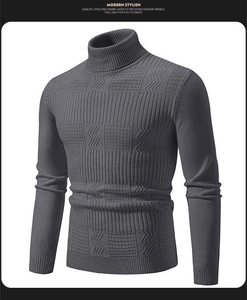 Detail of dark grey men's turtleneck sweater with geometric knit patterns and ribbed cuffs