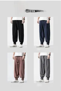 Detail of linen harem pants showing drawstring waist and tapered cuffs in four colors