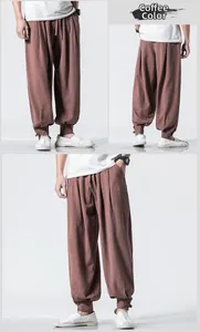Detail of coffee-colored linen harem pants showing drawstring waist and tapered button cuffs