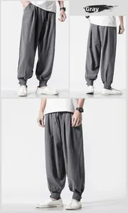 Detail of grey cotton linen harem pants featuring traditional Chinese button ankles