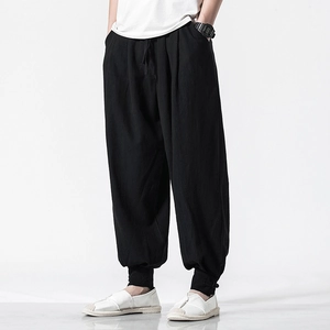 Linen harem pants for men with drawstring waist and buttoned cuffs in black