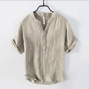 Close-up of khaki linen shirt featuring Henley collar with three buttons and textured fabric