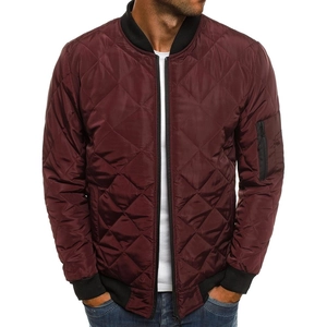 Detail view of burgundy quilted bomber jacket with black ribbed collar and sleeve zipper