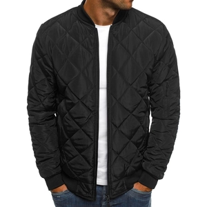 Close-up of black quilted jacket with bomber collar and utility zipper pocket details