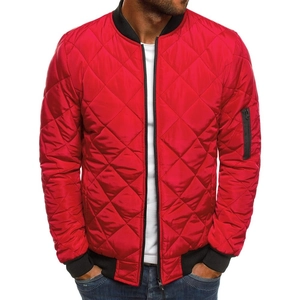 Detail of red quilted bomber jacket featuring diamond stitching and black ribbed collar