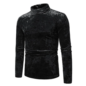 Detailed close-up of premium black gold velvet texture on a men's slim fit turtleneck shirt