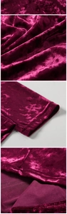 Macro detail of wine red velvet fabric showing embossed texture and stitching quality