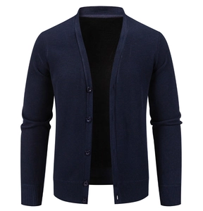 Detail view of navy blue V-neck cardigan featuring ribbed cuffs and five classic buttons