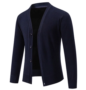 Detail view of navy blue V-neck knit cardigan showing rib-knit hem and button placket
