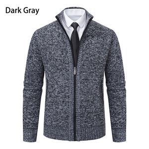 Macro detail of dark gray knit texture and zipper on men's stand collar cardigan