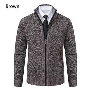 Close-up of brown knit cardigan featuring stand collar and full zipper closure