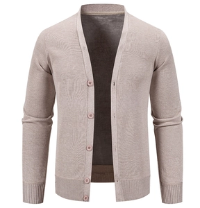 Close-up of ribbed cuffs and hem detail on light khaki V-neck men's knit cardigan