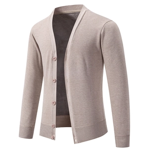 Close-up of V-neck light brown knit cardigan with ribbed cuffs and warm lining