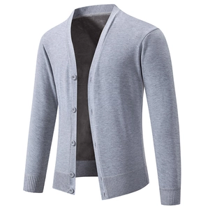 Detailed close-up of charcoal gray V-neck cardigan featuring rib-knit cuffs and hemline
