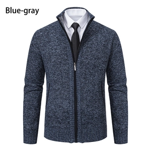 Detail of blue-gray knitted cardigan jacket with stand collar and zipper closure