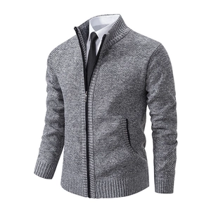 Detail view of grey knit cardigan with stand collar and fine textured ribbed cuffs