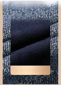 Detail of warm knitted vest showing thick blue fleece lining and grey marl knit texture
