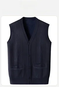 Close-up detail of dark blue V-neck knit vest featuring classic diamond textured patterns