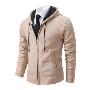 Detail of knitted men's zip hoodie with warm fleece lining and honeycomb texture fabric