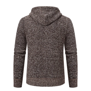 Rear view of brown knit cardigan sweater showing the hood and ribbed cuffs texture