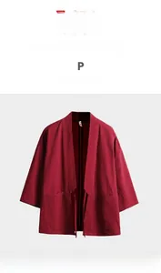 Detail of red cotton linen kimono cardigan with textured fabric and kimono-style front